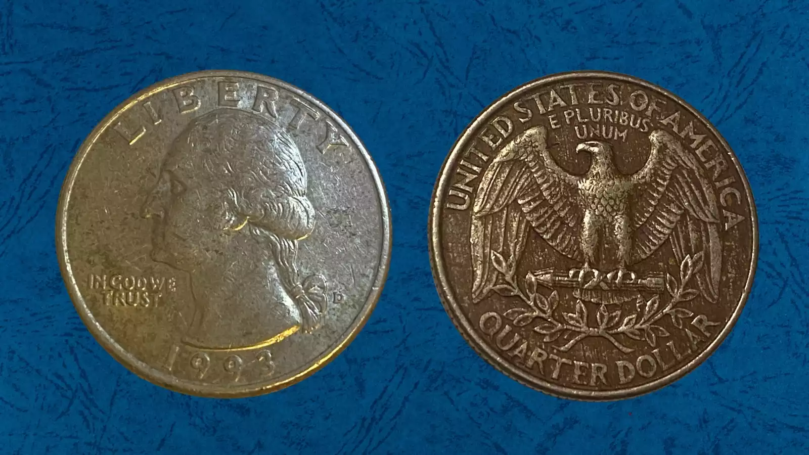 Side-by-side comparison: normal 1993 quarter vs missing clad layer variety showing exposed copper