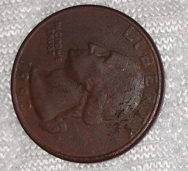 1993 quarter missing clad layer error showing copper-orange exposed substrate on coin face
